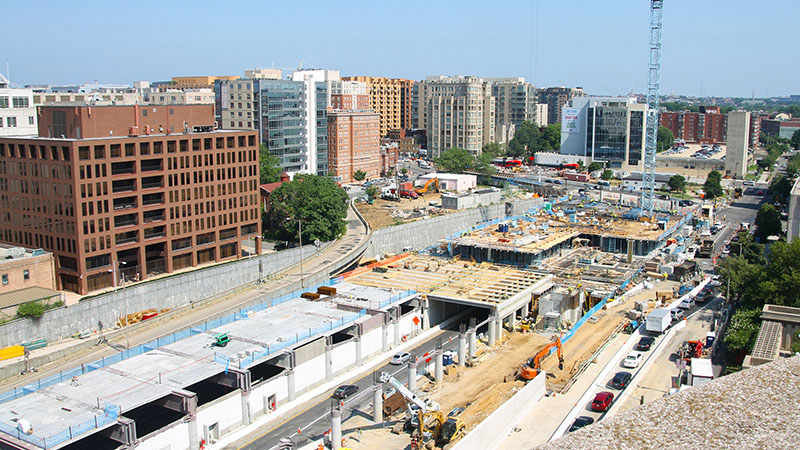 Aerial photo of construction on a three-block air rights development project near a section of I-395 near the Capitol.