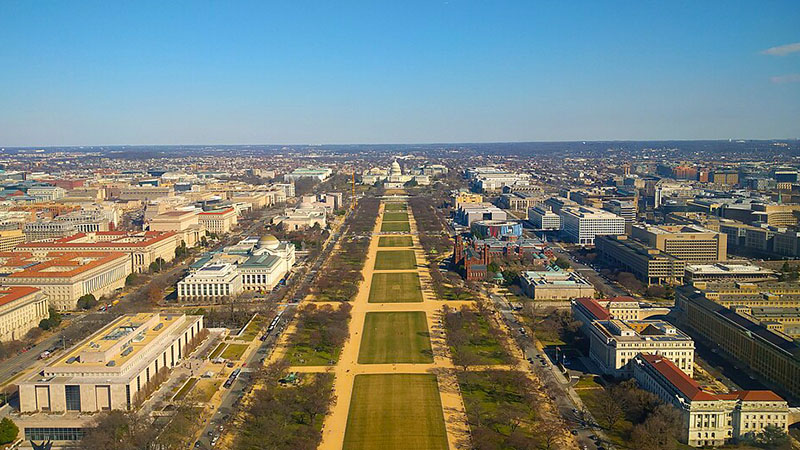 The national mall in Washington D.C facing east, taken atop the Washington Monument. In the middle of the picture sits capitol hill along with the Capitol Building. Taken during early spring, so the trees and grass aren't their usual green.